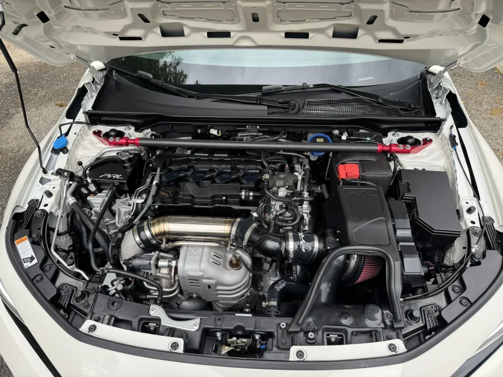 Detailed engine bay on a white performance car